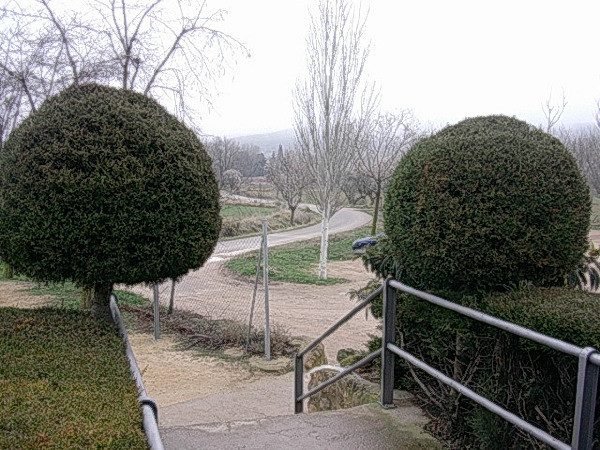 Vista desde la escalera de El Molino: el camino y los montes al fondo